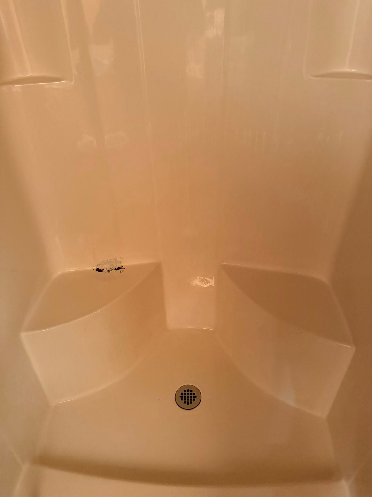 The same shower stall clean and bright after cleaning